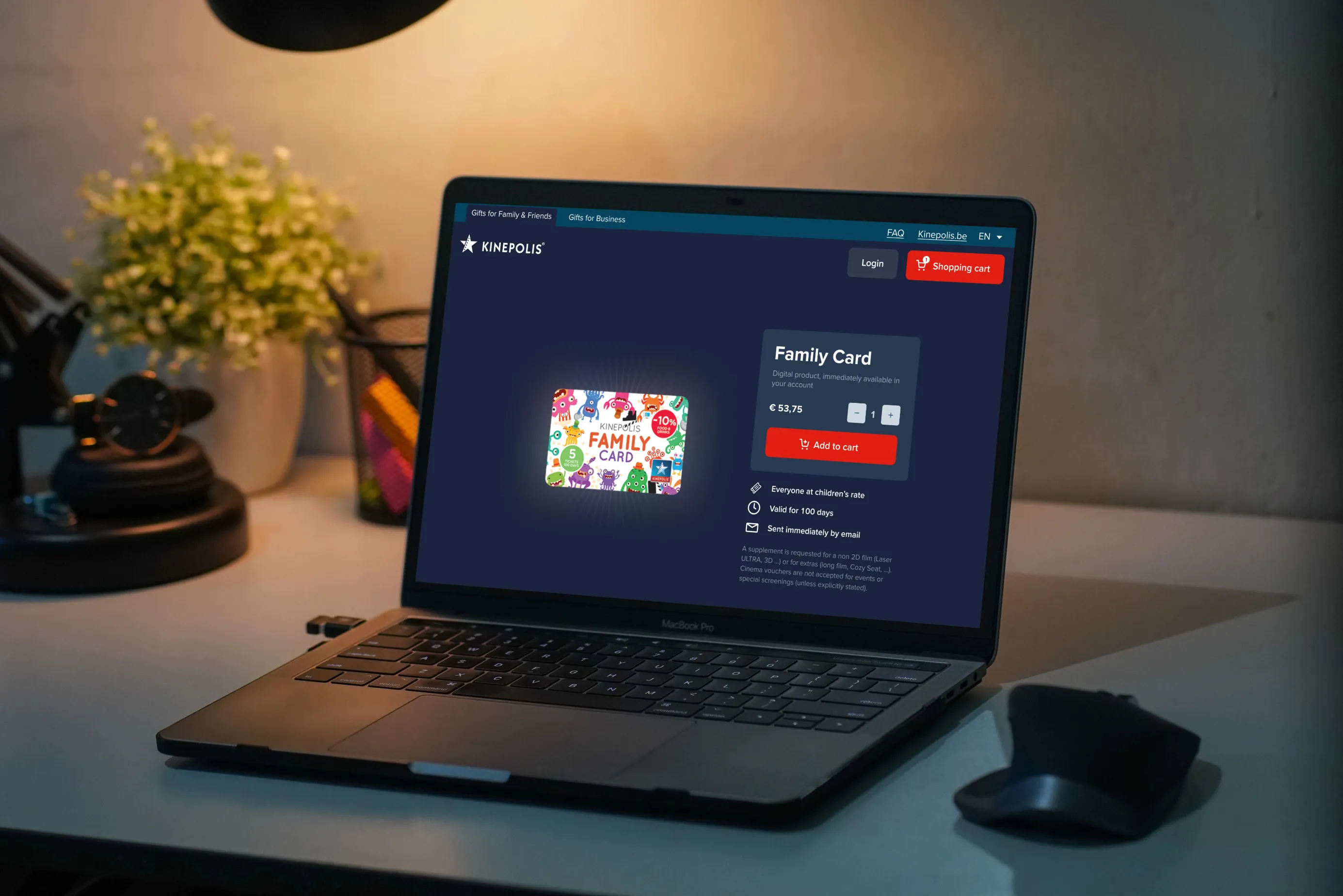 Laptop in a dark office setting, showing the Kinepolis Gift shop where you can buy a Family Card